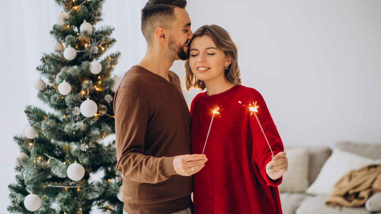 Couple celebrating Christmas together at home